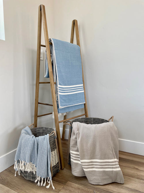 turkish towels and blankets on ladder and in basket